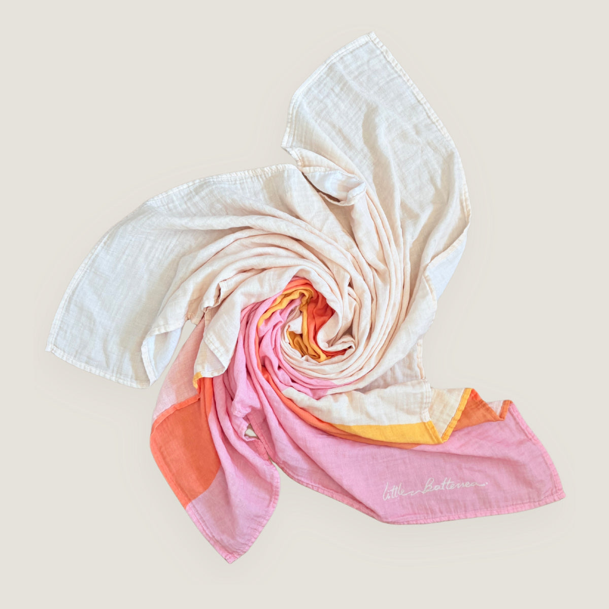 Colorful Indra Design scarf with a gradient pattern on a beige background