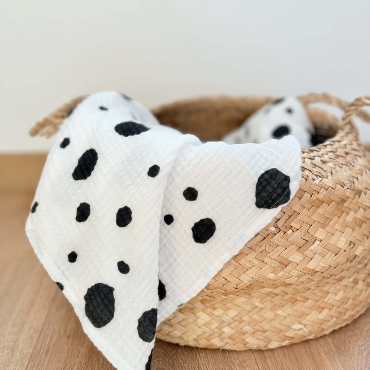 Allure en Noir design the Large square draped over a woven basket on a wooden surface.