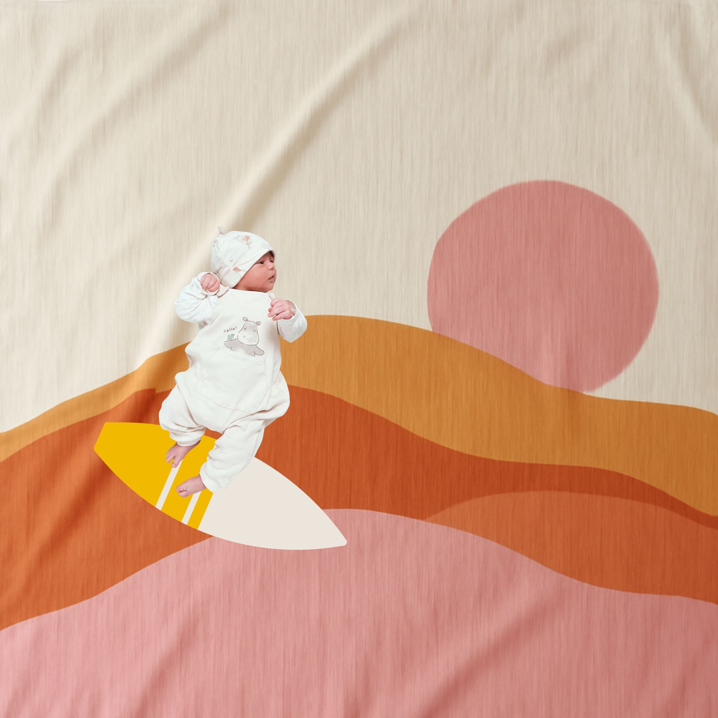 Golden Indra used flat as photo backdrop with baby Nico surfing on waves motif