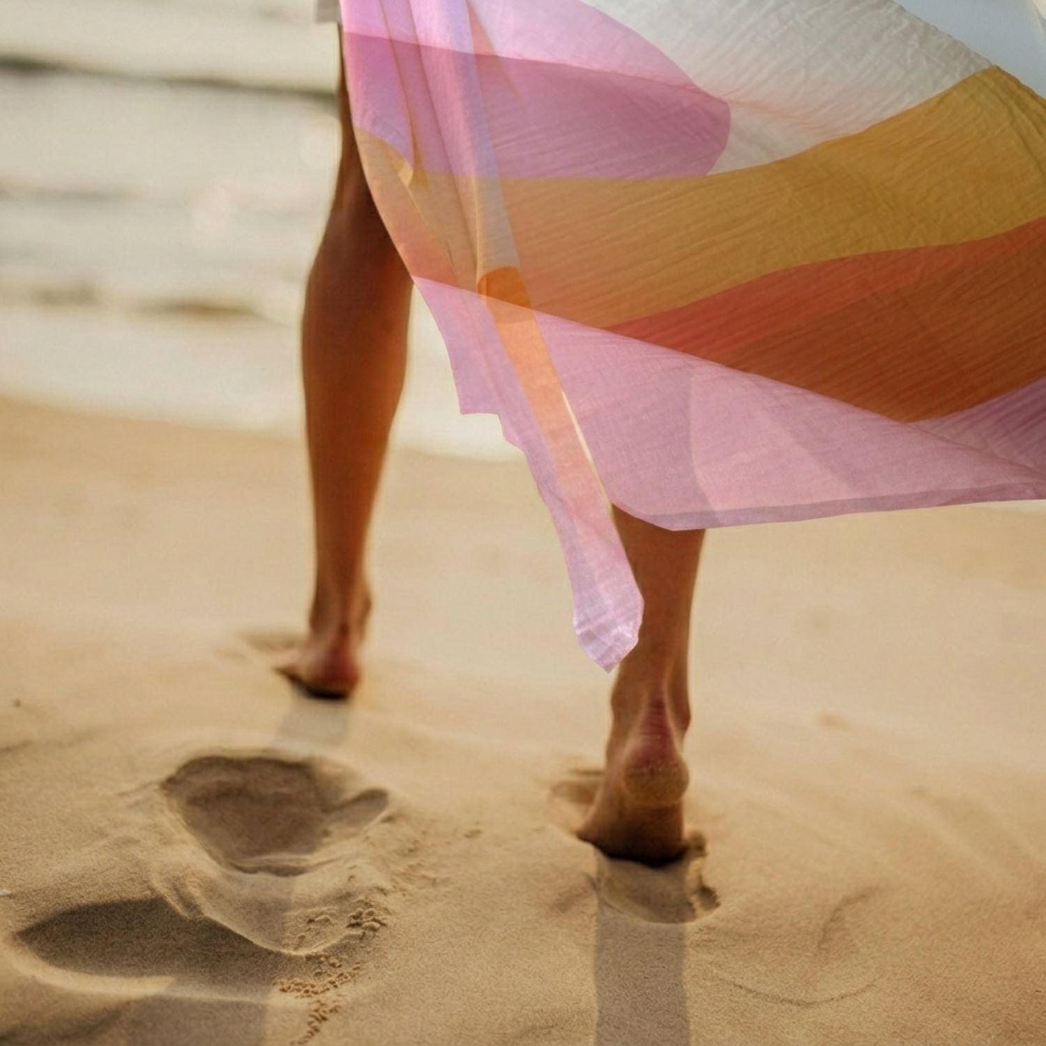 muslin blanket worn as sarong at the beach, an accessory in daily use
